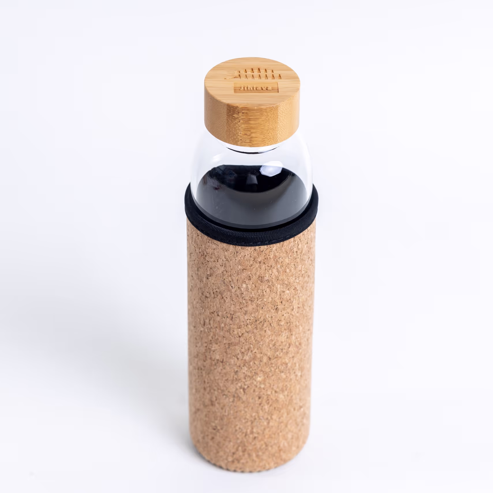 Skleněná láhev v korkovém obalu